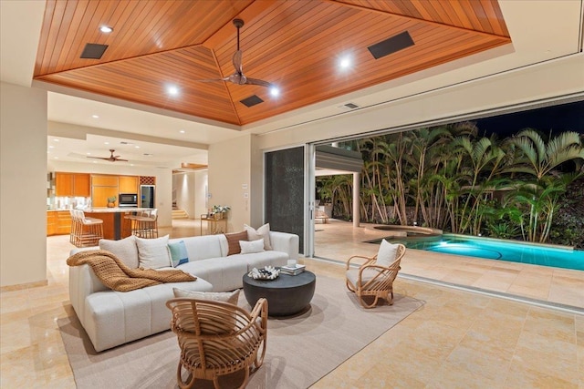 view of patio featuring an outdoor hangout area, ceiling fan, and an indoor pool