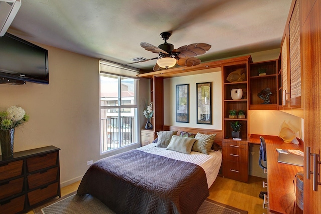 bedroom with light hardwood / wood-style floors and ceiling fan