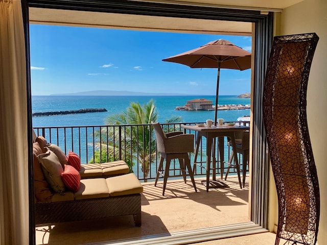 balcony featuring a water view