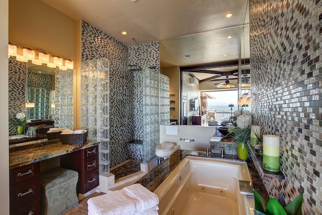 bathroom with shower with separate bathtub and tile walls