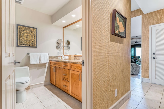 bathroom with ceiling fan, toilet, tile patterned floors, and vanity