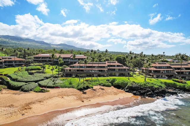 drone / aerial view featuring a water and mountain view