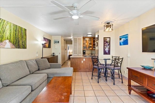 tiled living room featuring sink and ceiling fan