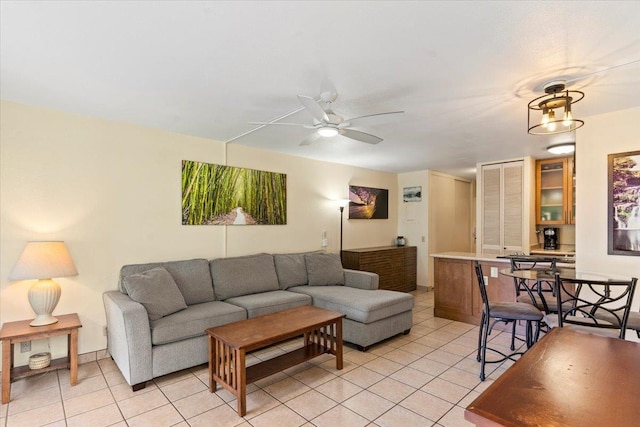 living room featuring ceiling fan and light tile patterned floors