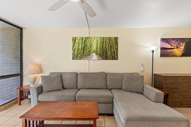 tiled living room with ceiling fan