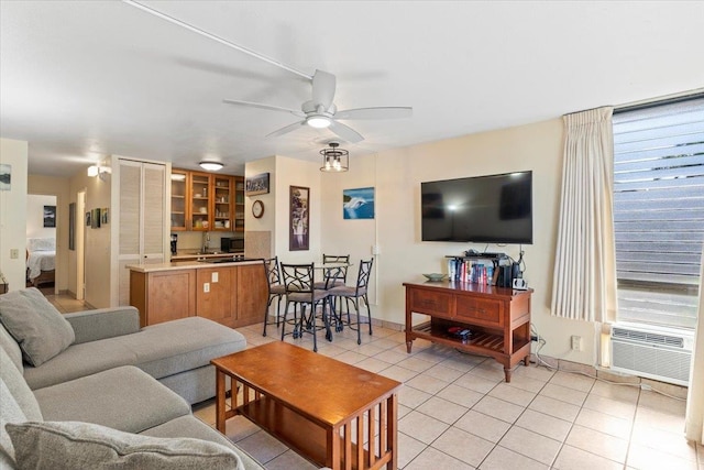 tiled living room featuring ceiling fan