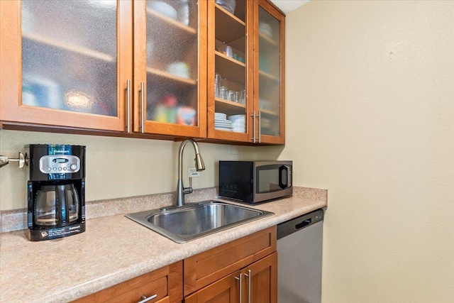 kitchen with appliances with stainless steel finishes and sink