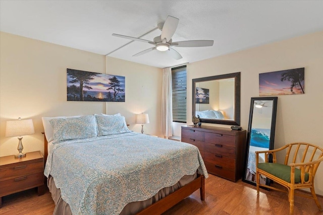 bedroom with hardwood / wood-style flooring and ceiling fan