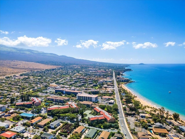 bird's eye view with a water and mountain view and a view of the beach