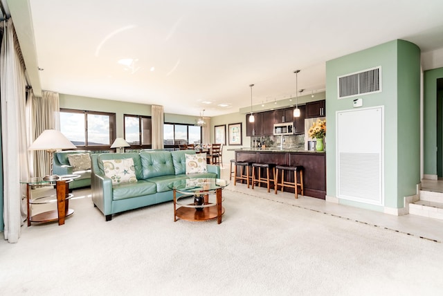 living room featuring light colored carpet