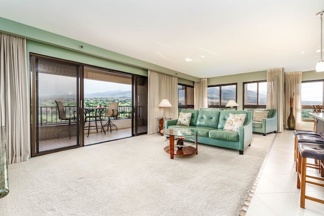 living room with light colored carpet and a mountain view