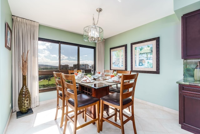 tiled dining area with a notable chandelier