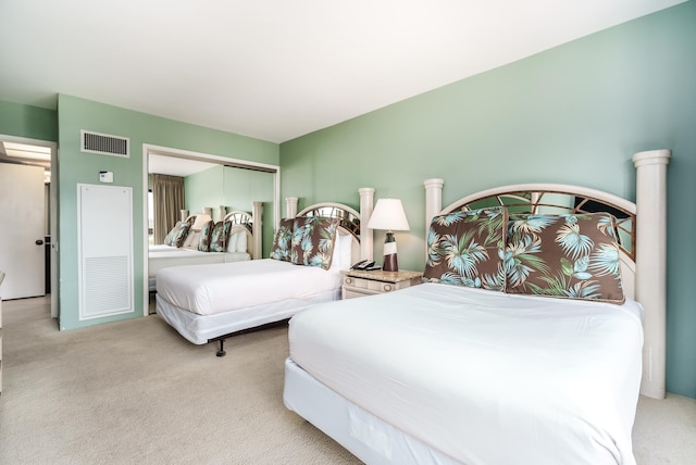 carpeted bedroom featuring a closet