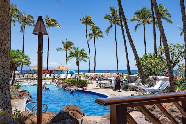 view of swimming pool with a water view