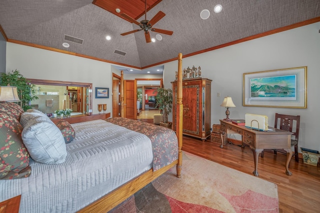 bedroom with hardwood / wood-style flooring, high vaulted ceiling, ceiling fan, and crown molding