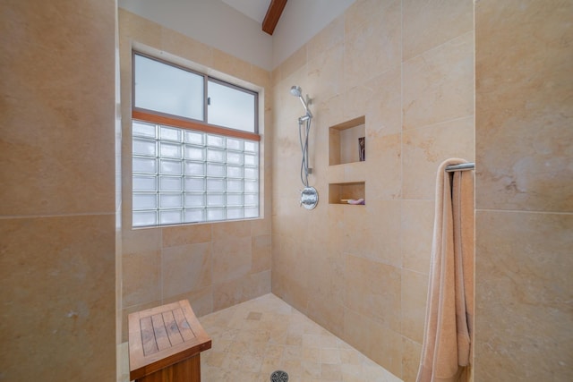 bathroom featuring a tile shower