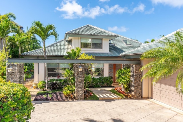 back of property with a garage