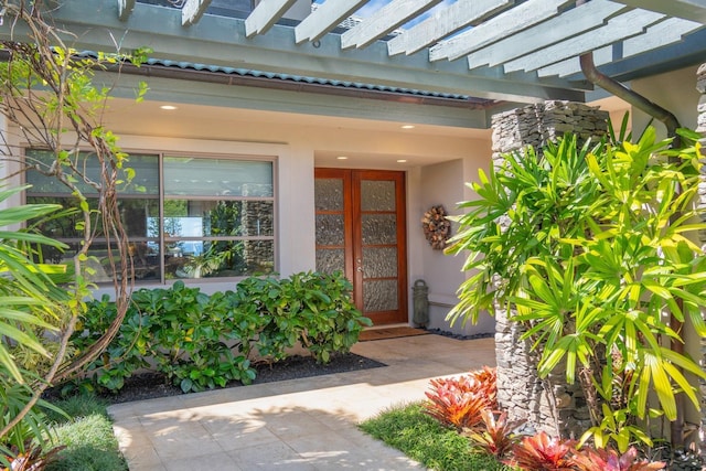 doorway to property with a pergola