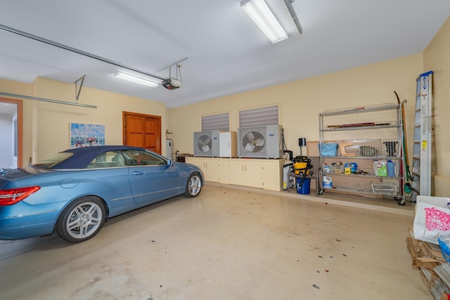 garage with a garage door opener and water heater