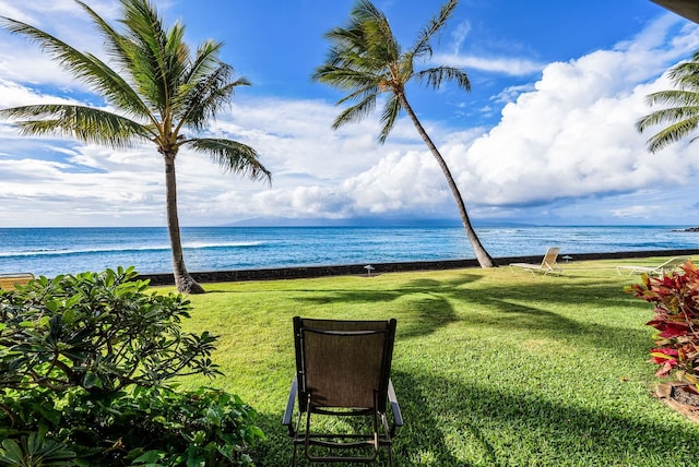 surrounding community featuring a yard and a water view