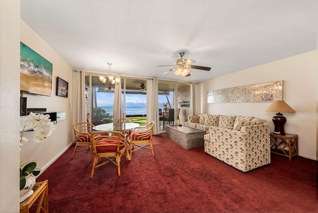 dining area with dark colored carpet and ceiling fan with notable chandelier