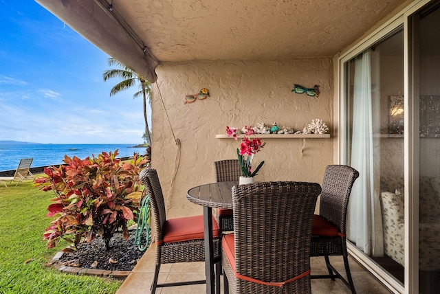 balcony featuring a water view