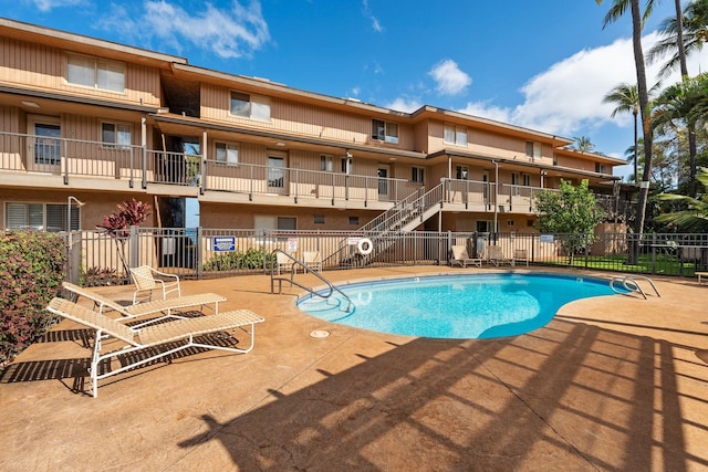 view of swimming pool with a patio