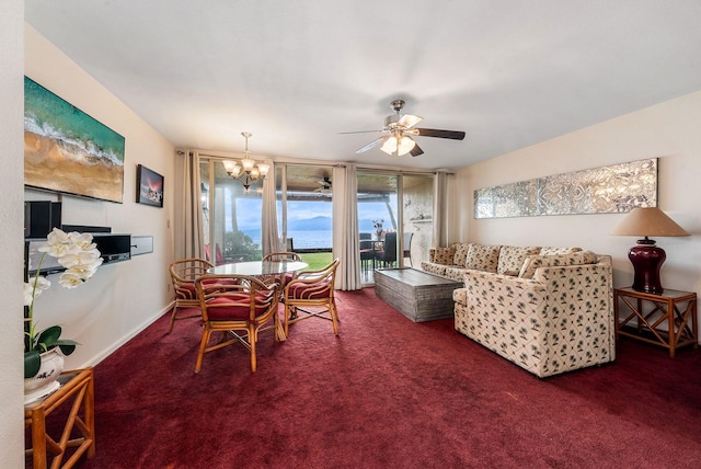 carpeted dining room with ceiling fan with notable chandelier