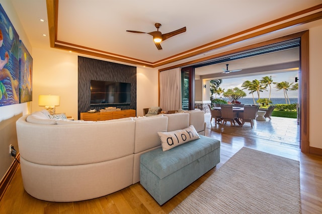 1 Bay Dr Unit 1204, Lahaina, HI 96761 - living room with a ceiling fan, wood finished floors, a tray ceiling, and baseboards
