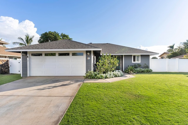 ranch-style home with a garage and a front lawn