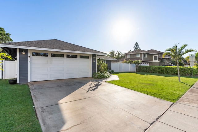 view of front of house with a front lawn and a garage