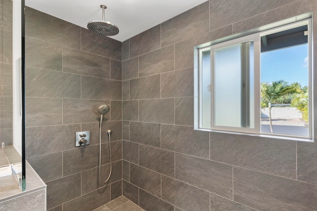 bathroom featuring a tile shower