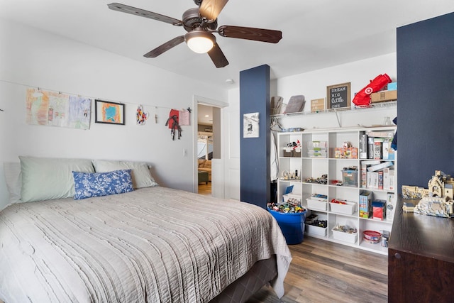 bedroom with wood-type flooring and ceiling fan