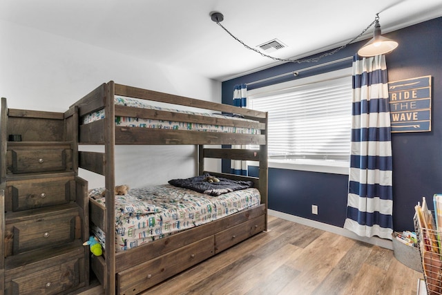 bedroom with wood-type flooring