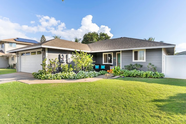 ranch-style home with a garage and a front lawn