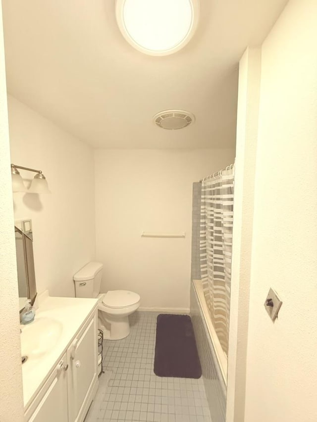 full bathroom with vanity, shower / bathtub combination with curtain, tile patterned floors, and toilet