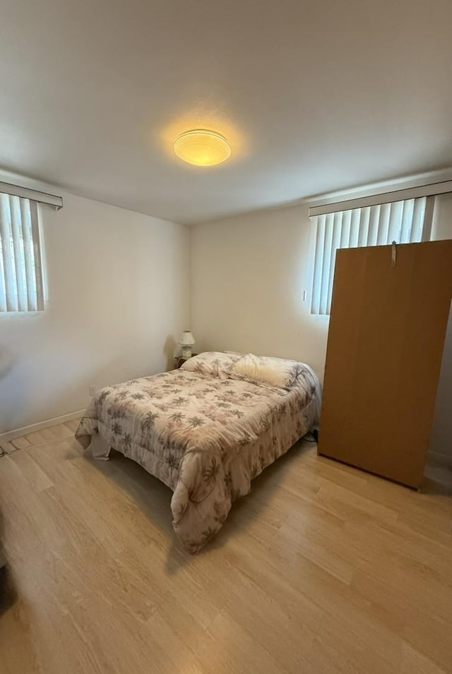 bedroom with light wood-type flooring