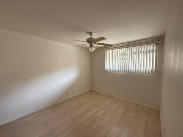 unfurnished room with ceiling fan and light hardwood / wood-style flooring