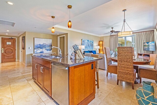 130 Kai Malina Pkwy Unit Sr409, Lahaina, HI 96761 - kitchen featuring a sink, dishwasher, dark stone countertops, a kitchen island with sink, and brown cabinets