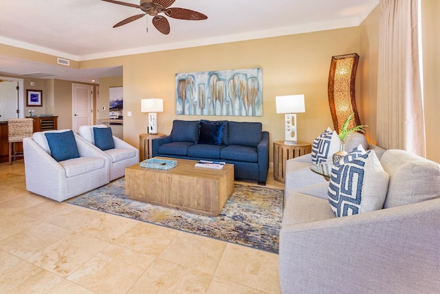 tiled living room featuring ceiling fan