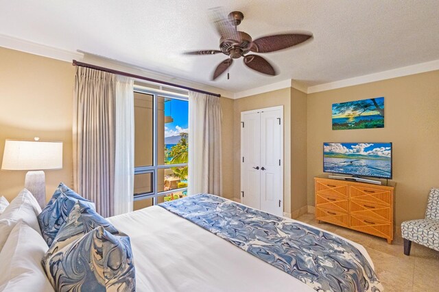 130 Kai Malina Pkwy Unit Sr409, Lahaina, HI 96761 - bedroom with ornamental molding, a ceiling fan, and a textured ceiling