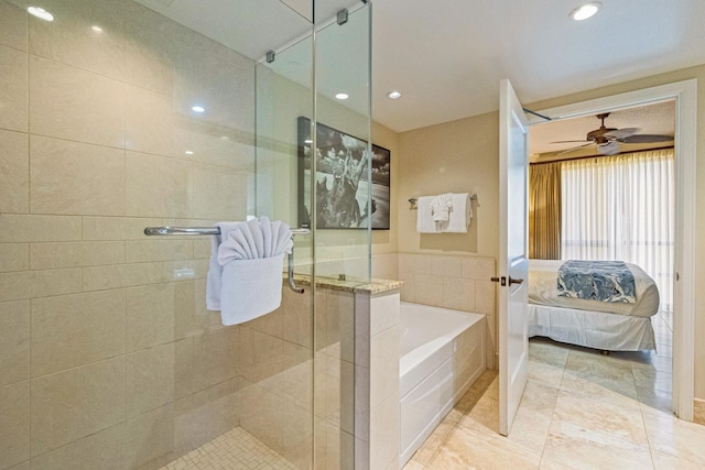 bathroom with plus walk in shower, tile walls, ceiling fan, and tile patterned floors