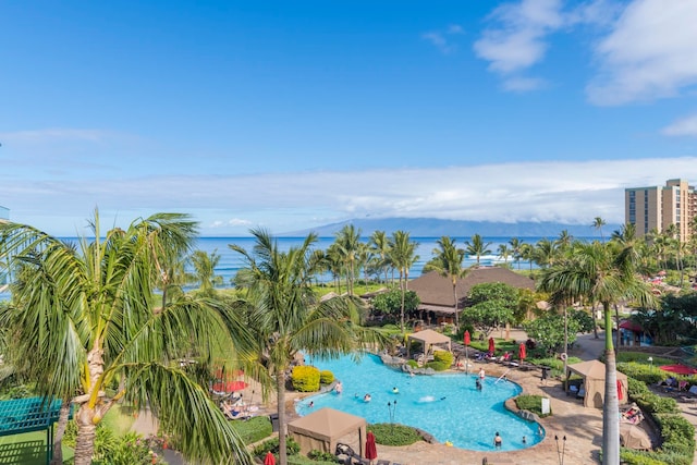 view of pool with a water view