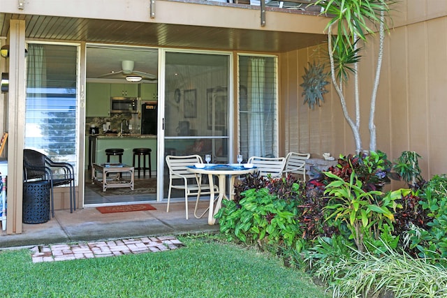 entrance to property with a patio area