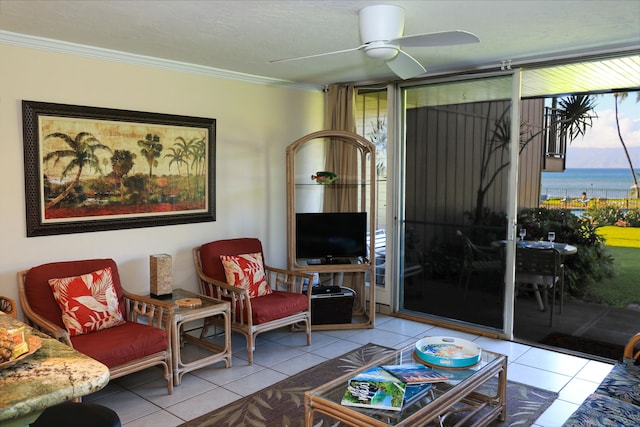 tiled living room with ceiling fan and ornamental molding