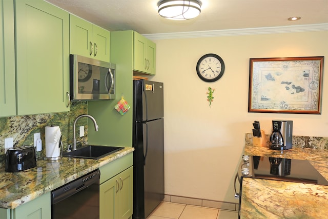 kitchen featuring black appliances, green cabinetry, and sink