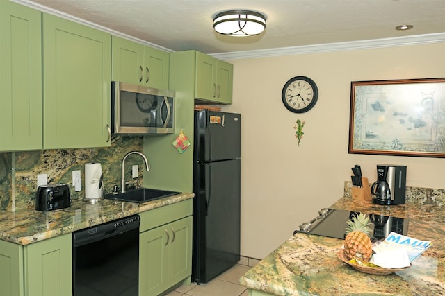 kitchen featuring green cabinetry, light stone countertops, sink, black appliances, and light tile patterned flooring