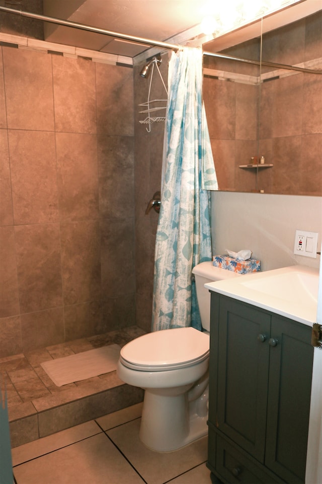 bathroom featuring vanity, toilet, a shower with shower curtain, and tile patterned flooring