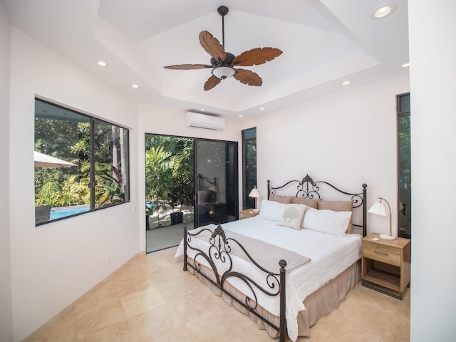 bedroom featuring a wall mounted air conditioner, ceiling fan, a raised ceiling, and access to outside