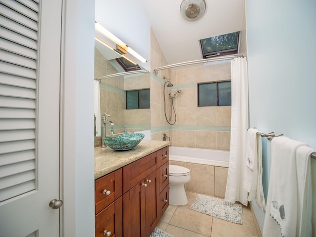 full bathroom with tile patterned flooring, vaulted ceiling, toilet, vanity, and shower / tub combo